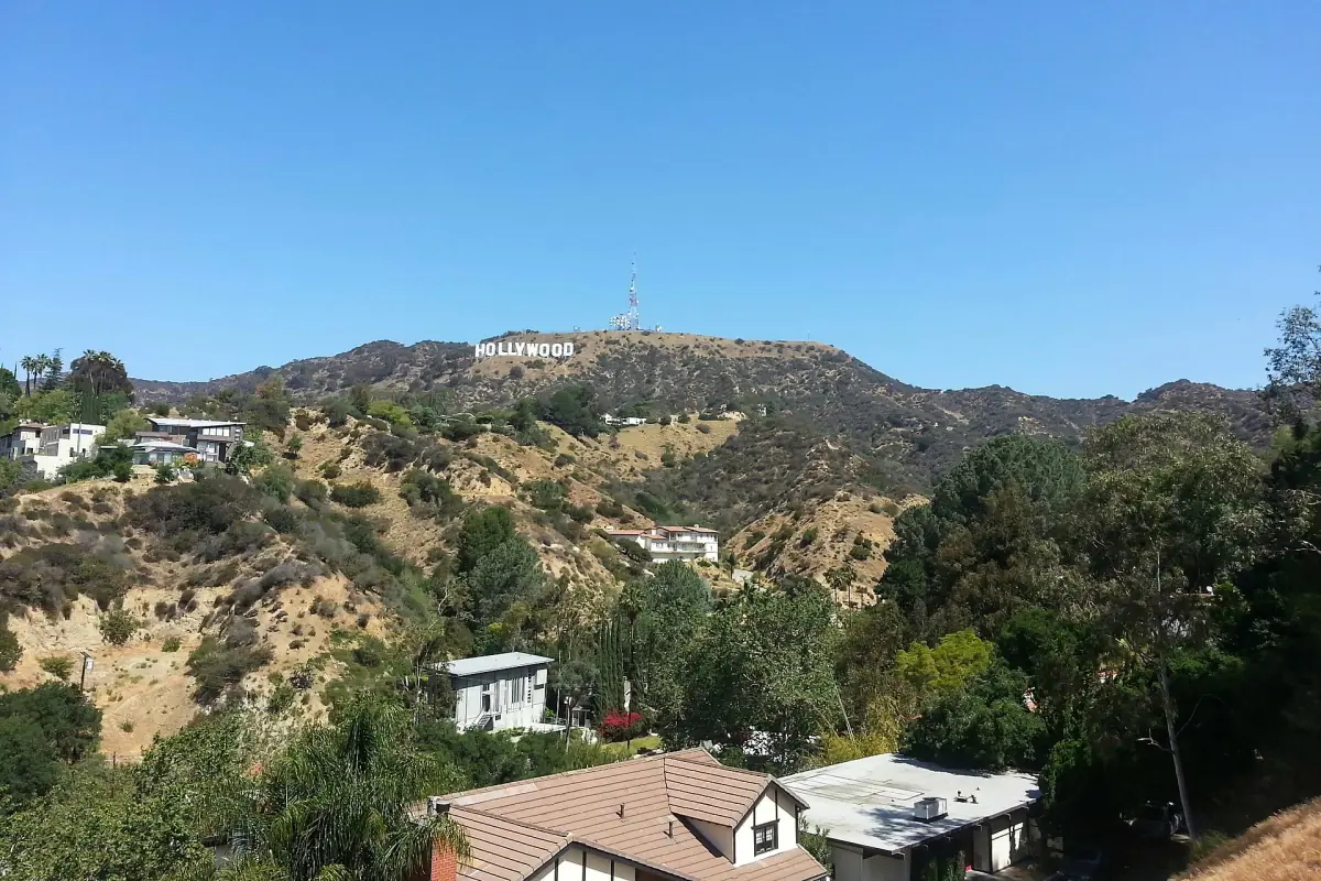Hollywood Hills homes below the sign