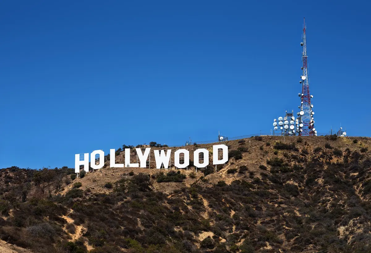 The Hollywood Sign on Mount Lee under a blue sky